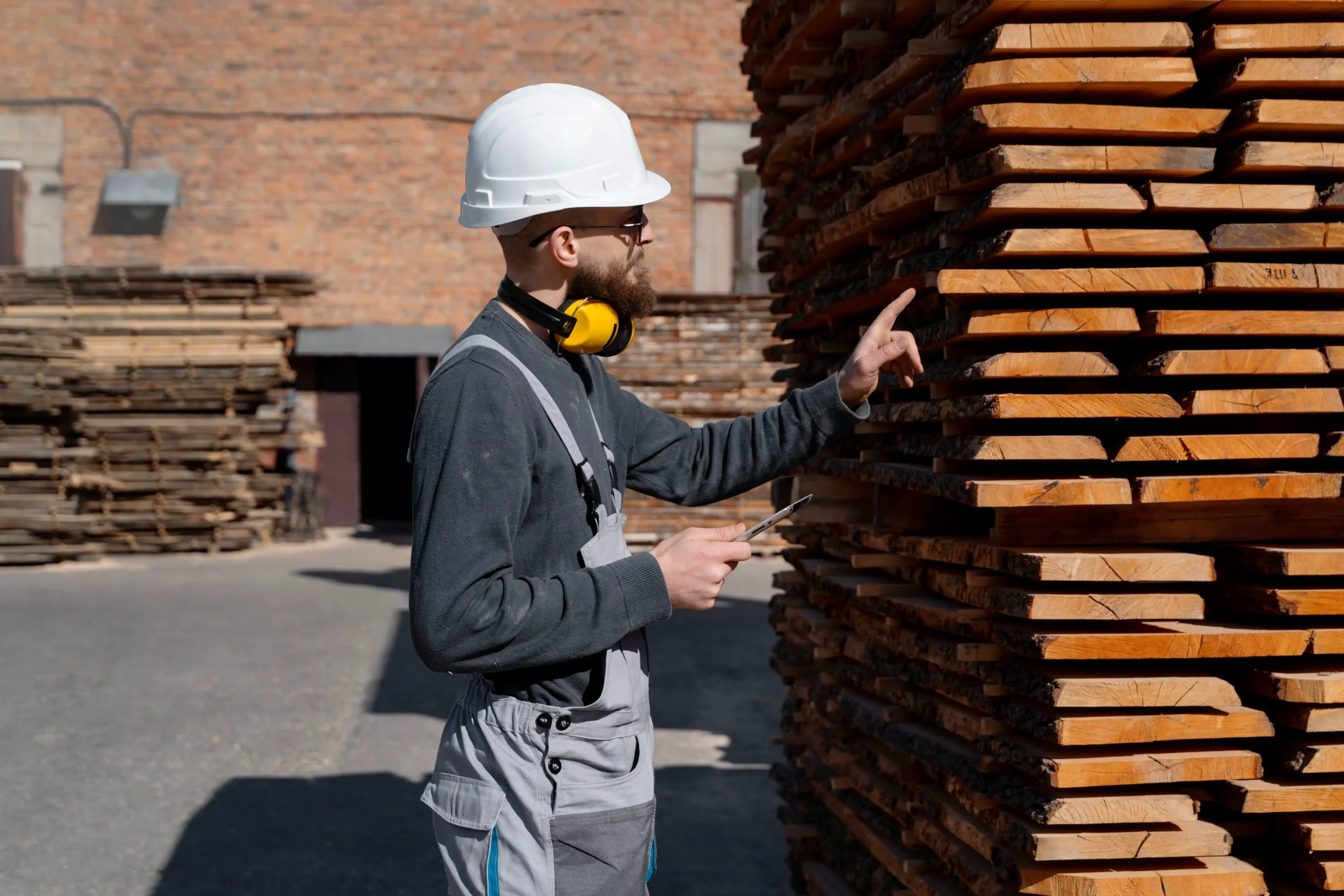 man-working-mdf-boards-warehouse